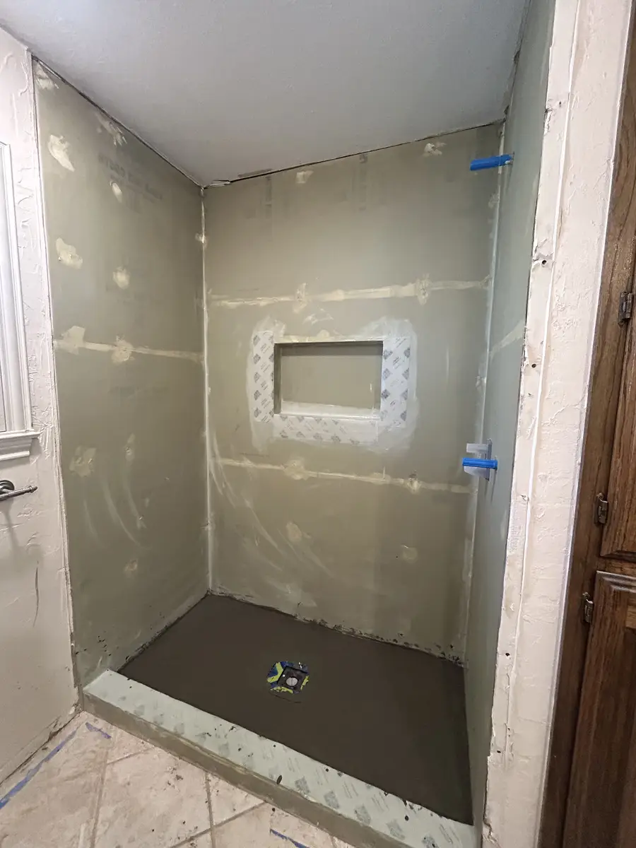 Shower pan and cement board substrate with niche framed and ready for waterproofing and tile