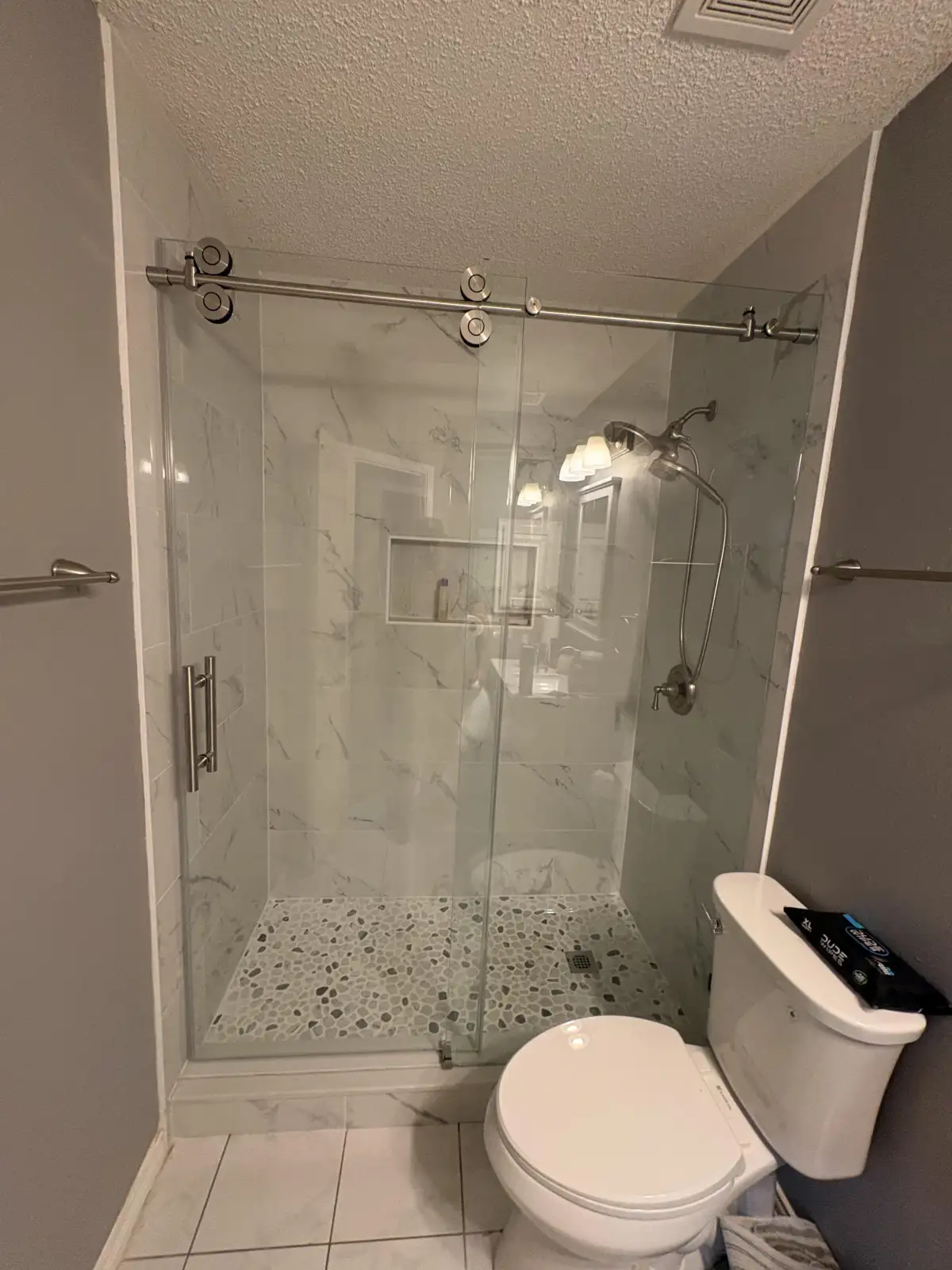 Completed tiled shower built within a former bathtub footprint