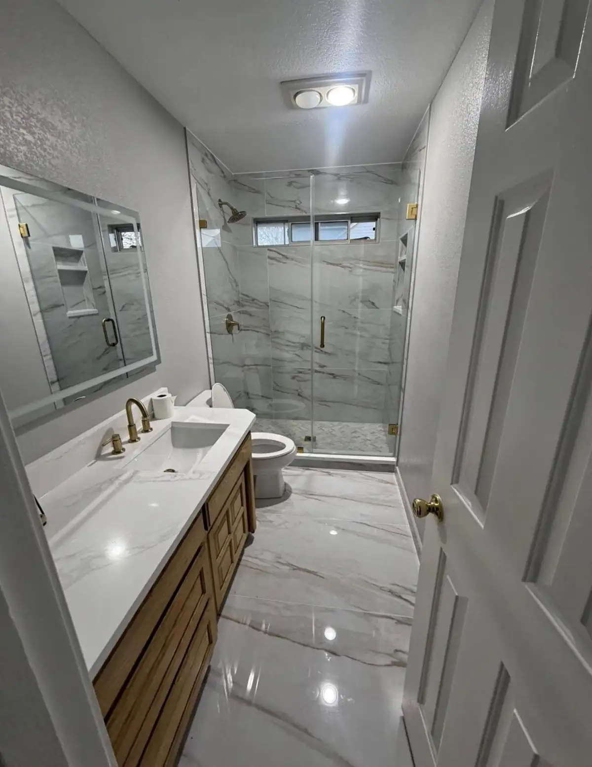 Walk-in shower installation with frameless glass door in DFW home