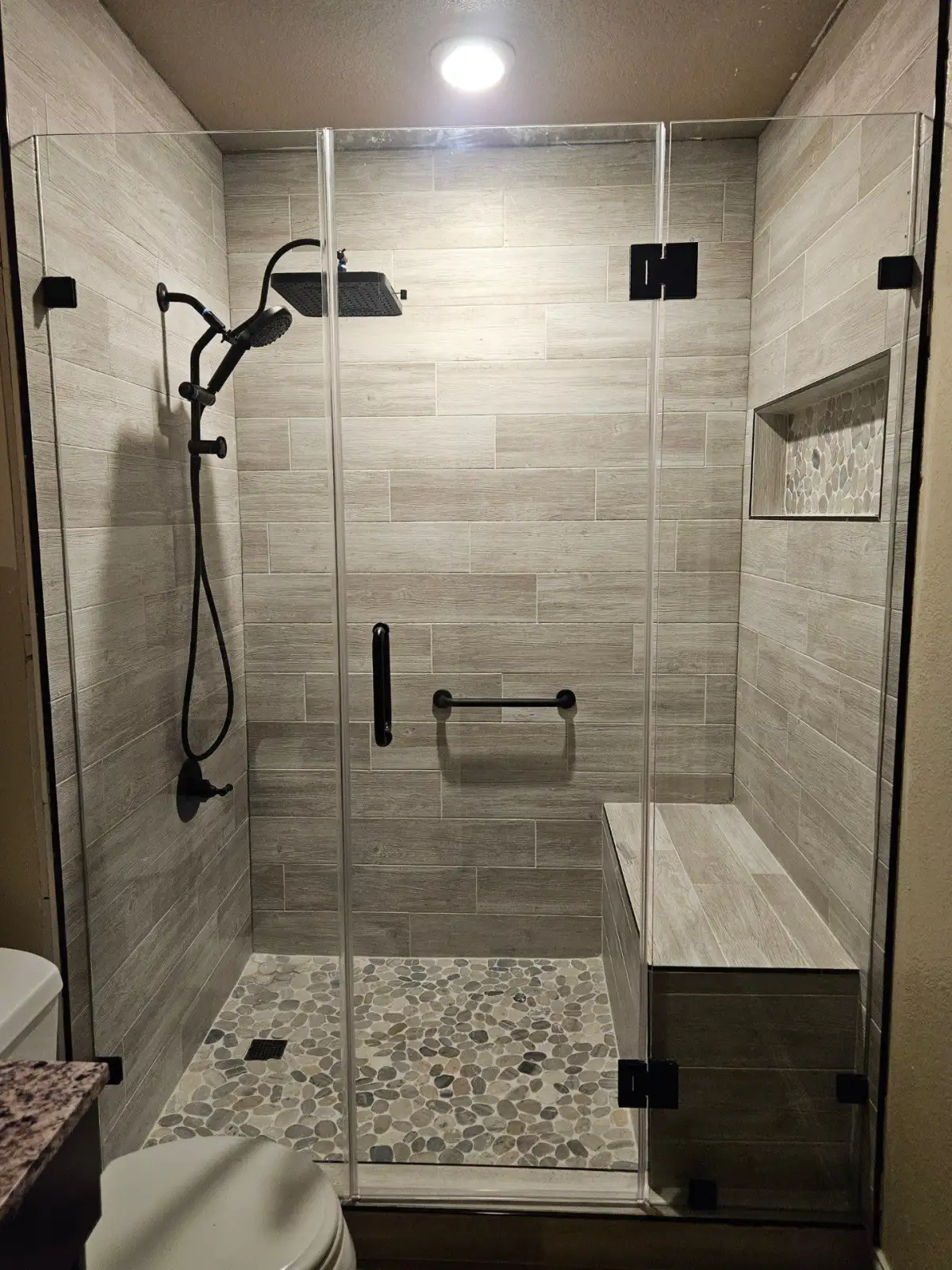 Curbless shower with linear drain and large-format tile in Mansfield